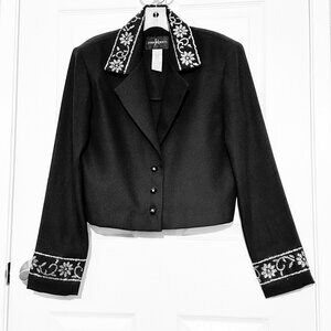 Dressy black cropped jacket decorated with shiny silver-colored studs